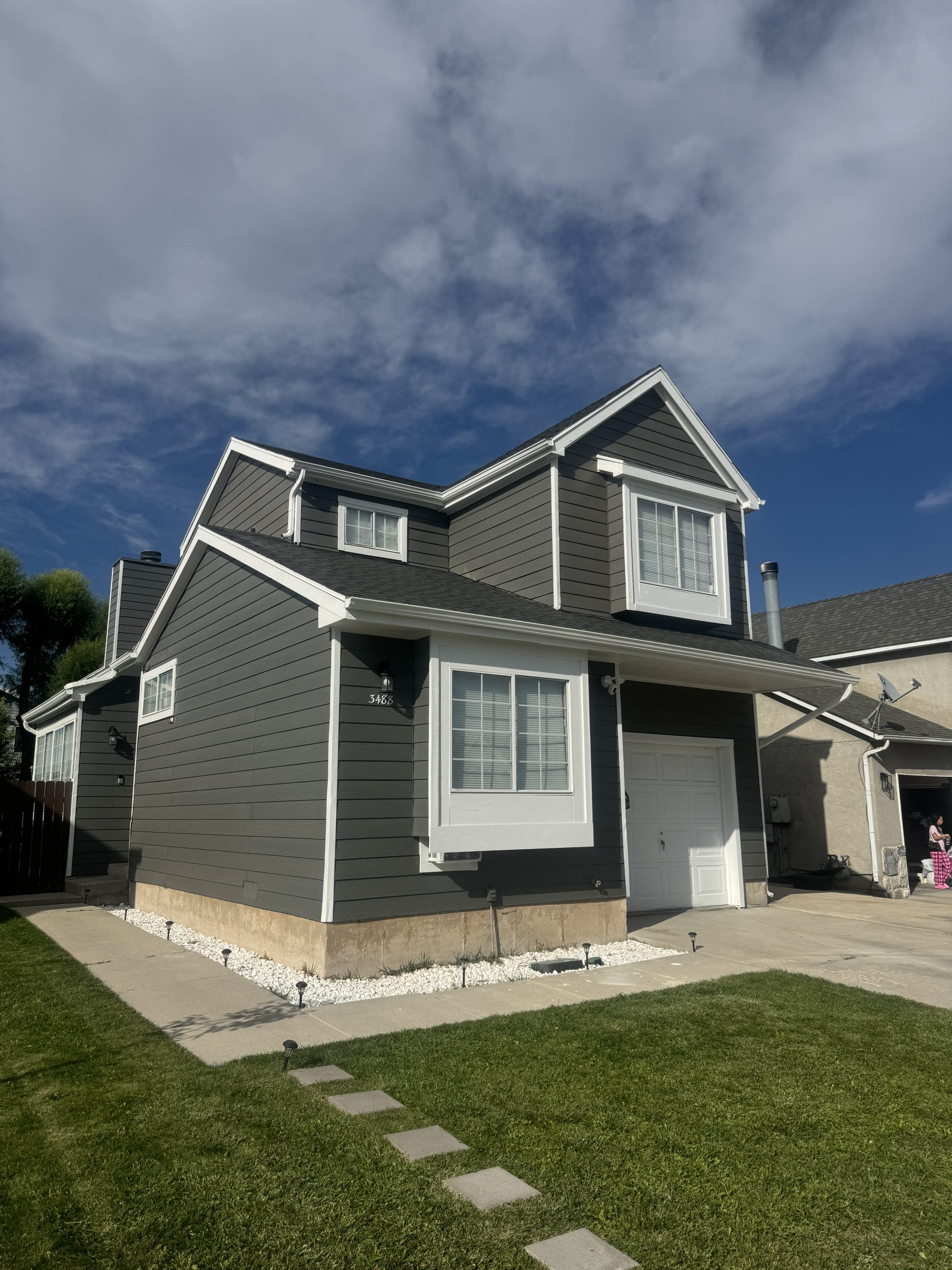 Charcoal gray exterior repaint with white trim