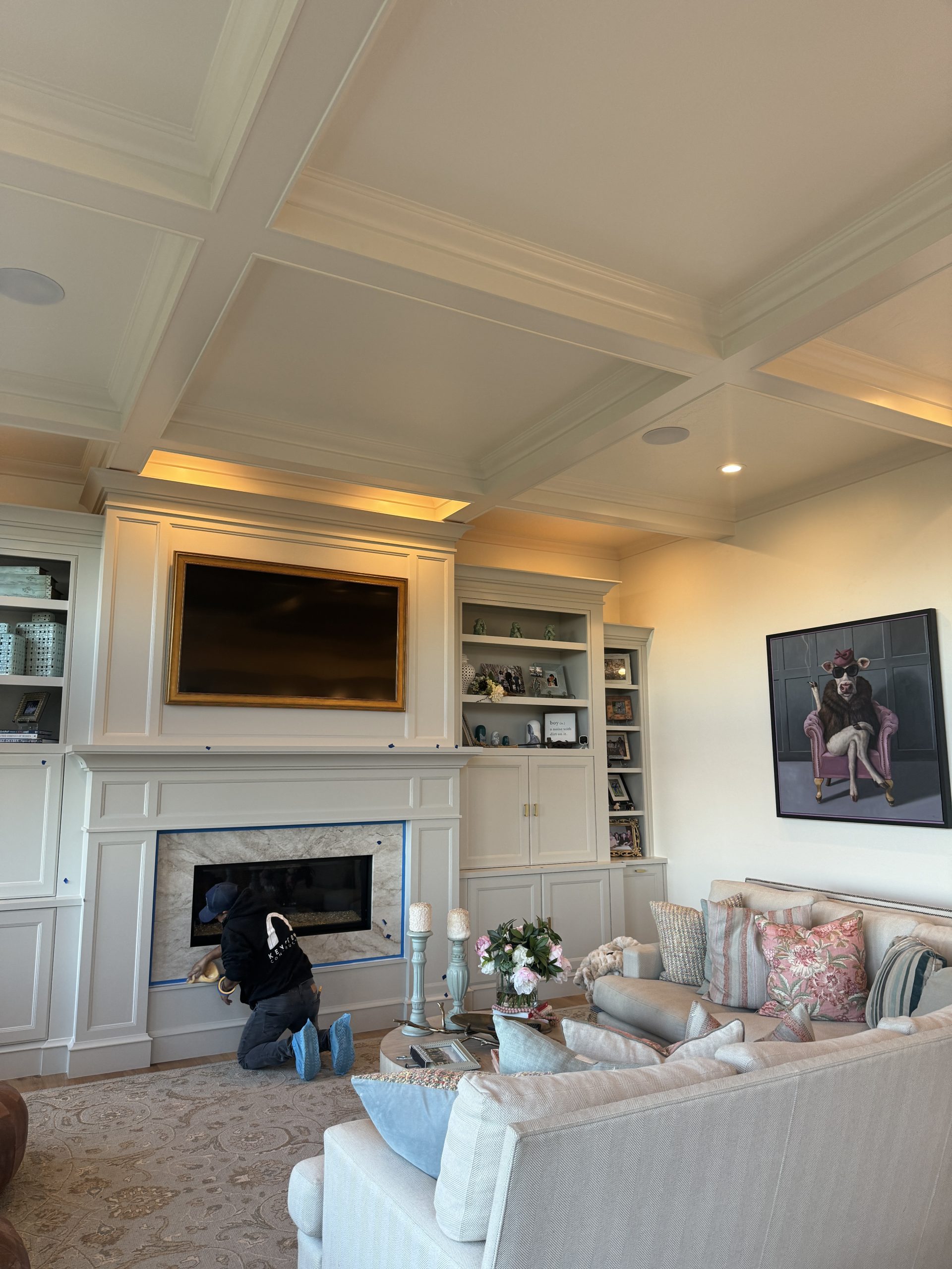 Coffered ceiling and built-ins painted in warm white