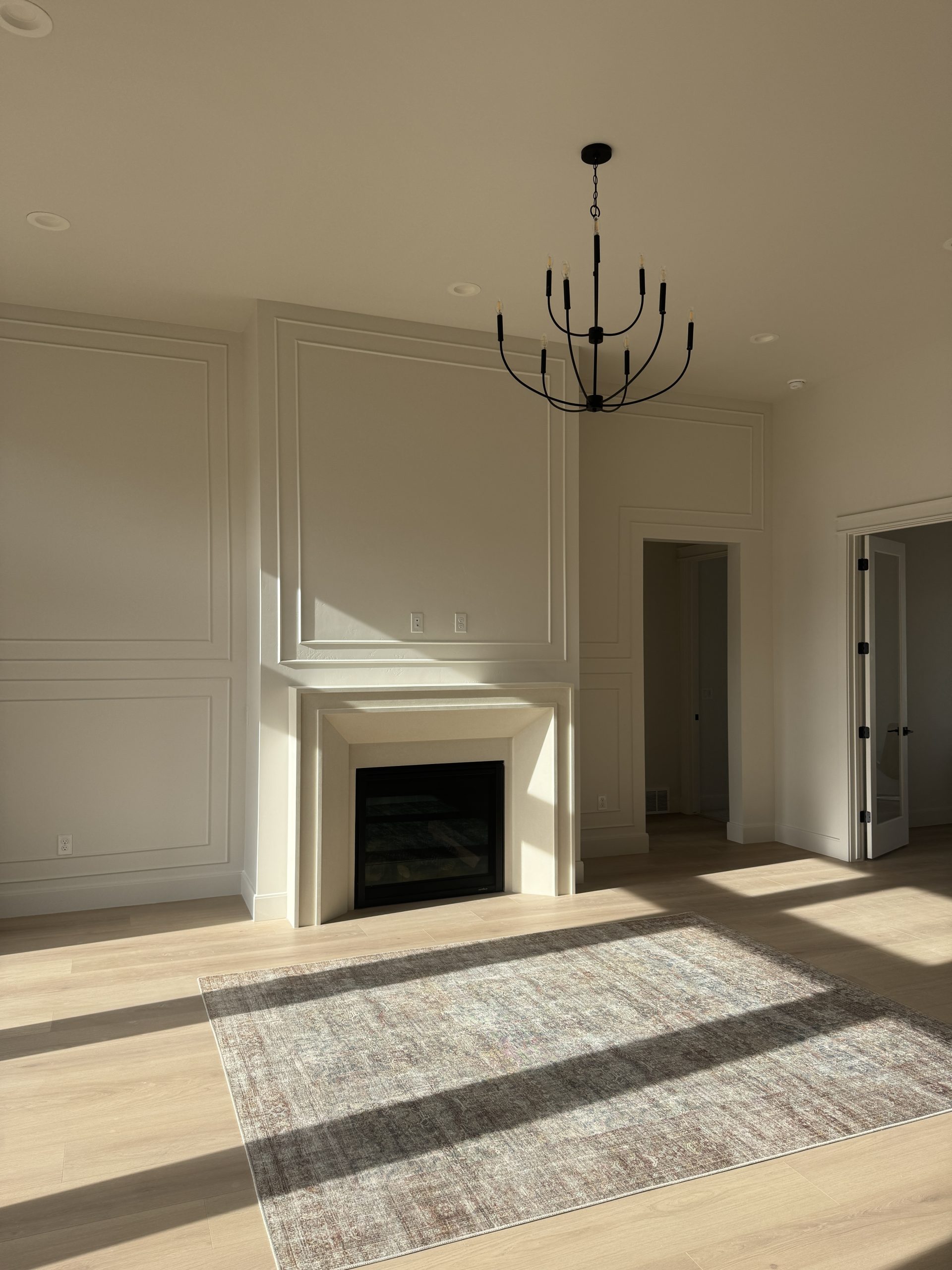 Wall paneling and fireplace surround in soft cream